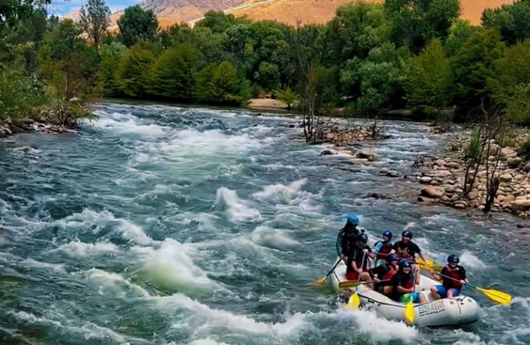 Rafters float right by The Kern River House at Big Daddy Rapids!